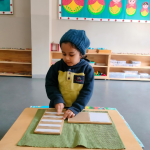 Kid engaging in touch tablet Montessori activities at The Nurtuary Preschool, the best playschool near me in Sector 20 Panchkula