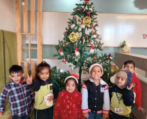 Kid enjoying Christmas celebrations at The Nurtuary Preschool, best playschool in Zirakpur
