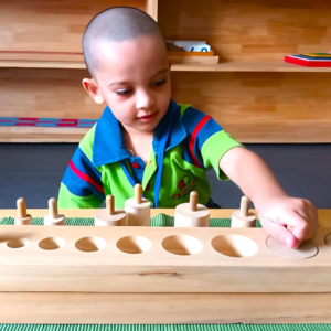 Kid engaging in Montessori knob cylinder activity at The Nurtuary Preschool Sector 20 Panchkula