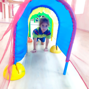 Preschool activities: Children enjoying a tunnel crossing activity at The Nurtuary Preschool in Sector 20, Panchkula